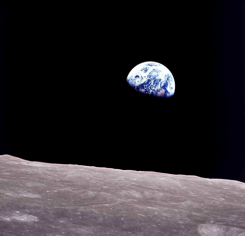 The Earthrise photograph taken by Apollo 8, showing Earth above the lunar horizon
